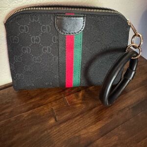 EUC Black GD Wristlet with Red and Green Stripe